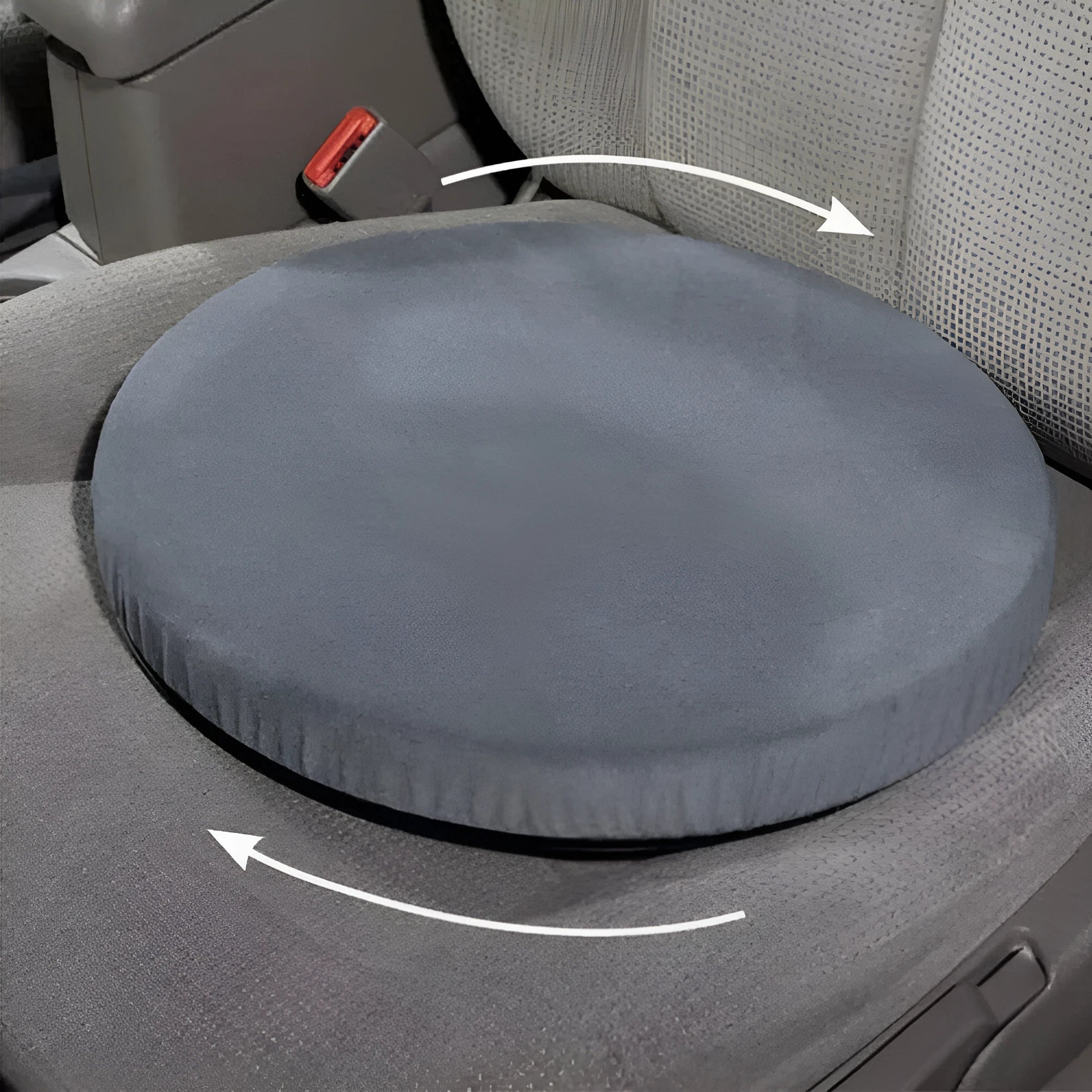 Grey rotating car seat cushion with a non-slip base on a car seat.