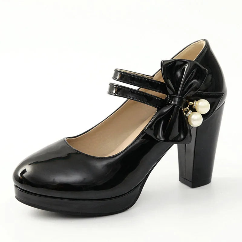 Red platform shoes with a thick chunky heel, round toe, and buckle fastening on a white background.