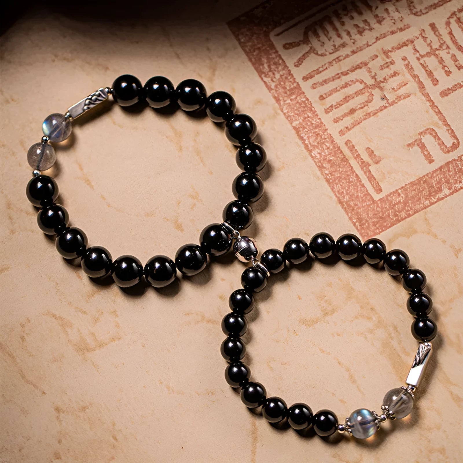Obsidian Buddha beads couple bracelet DIY kit showing 8mm and 10mm beads with elastic cord