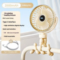 A beige portable clip-on fan with three blades, mounted on a stroller handle, showing its rotating head.