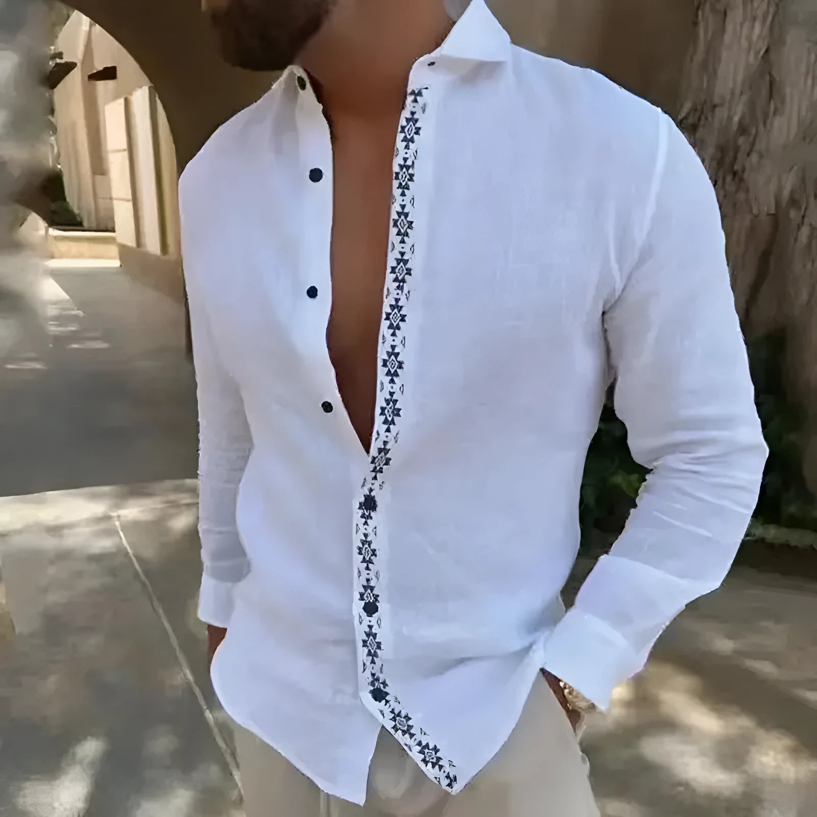 Cotton and linen printed men's shirt with lapel button, long sleeves, and collage stitching in emerald green