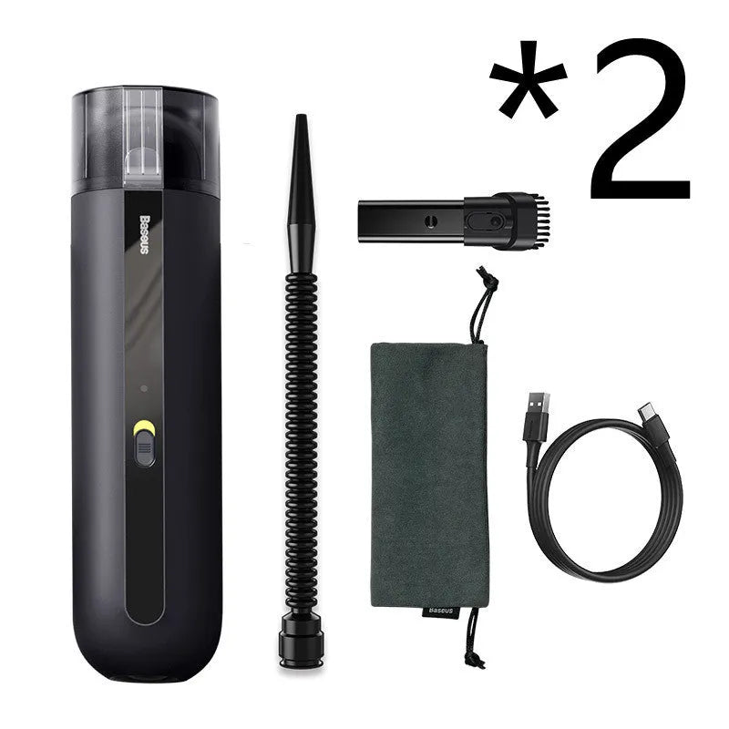 Starry sky black handheld car vacuum cleaner with a blowing hose attachment on a car seat.