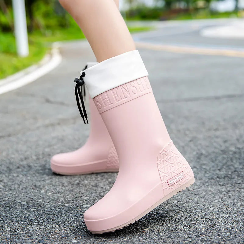 Women's solid colour rain boots with non-slip soles in apricot, black, brown, and pink waterproof finishes