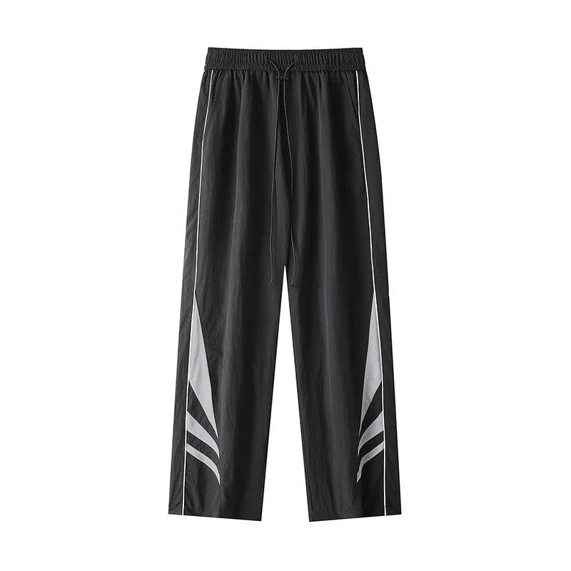 Plus-size men's straight-leg casual sports trousers in grey, showing loose fit and elastic waist.