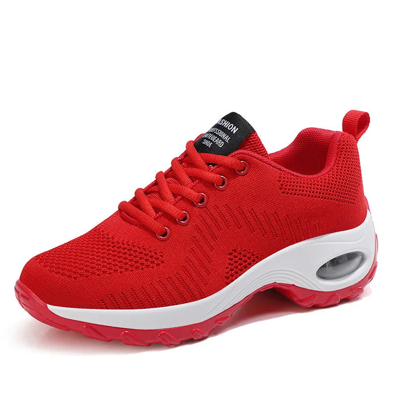 Women's red and black round toe lace-up mesh sneakers on a white background, showing the low-top profile and flat PU sole.