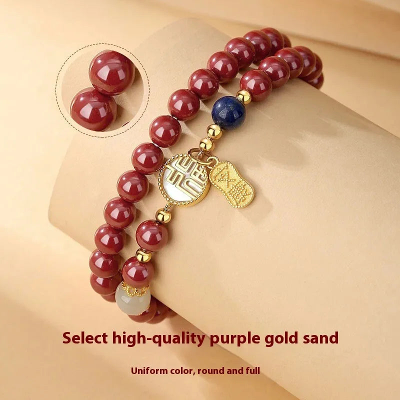 S925 sterling silver bracelet with Chinese blessing charms, cinnabar red and white shell accents on purple gold sandstone.