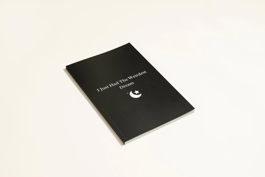 Black leather-bound dream journal notebook with business simplicity style.