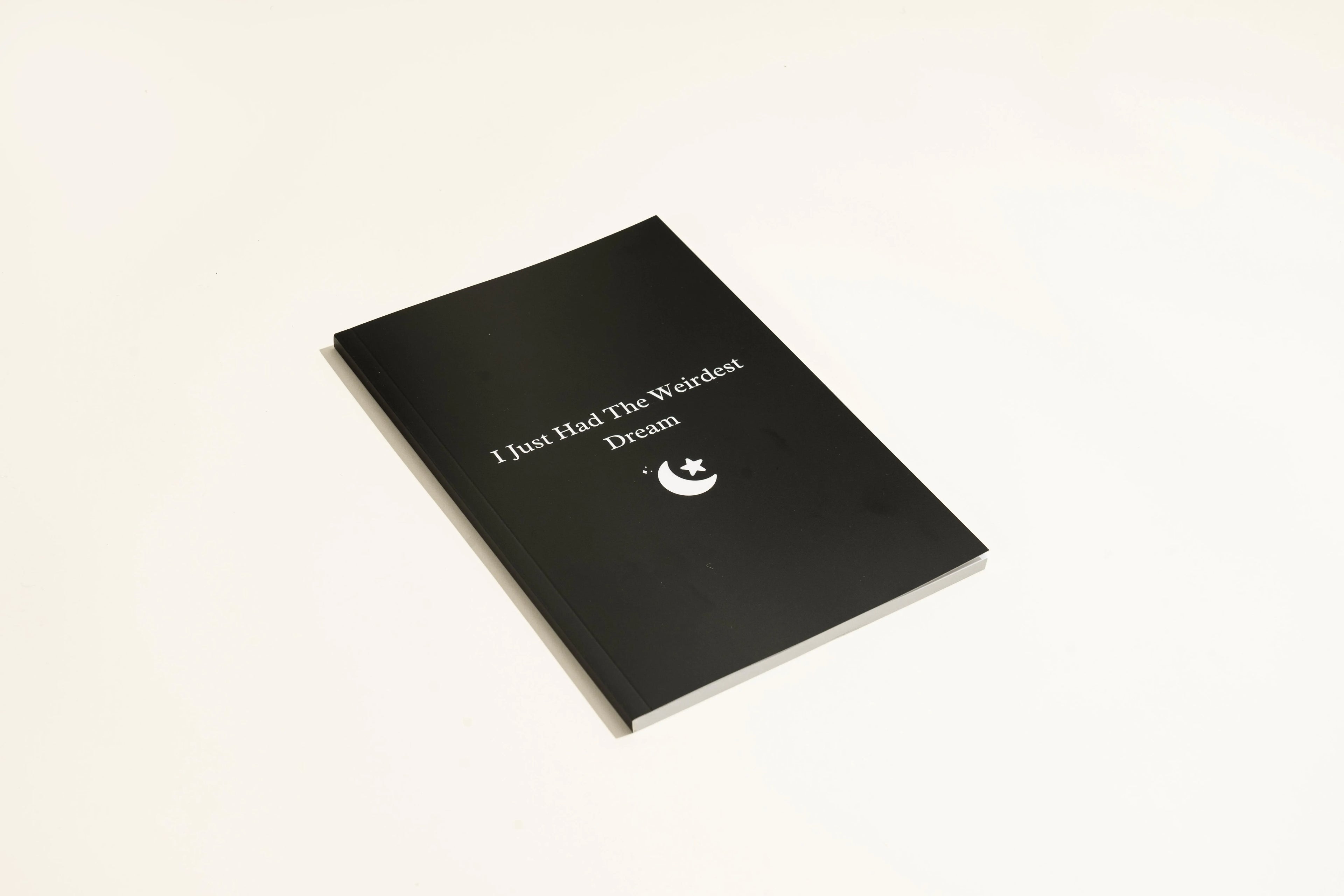 Black leather-bound dream journal notebook with business simplicity style.
