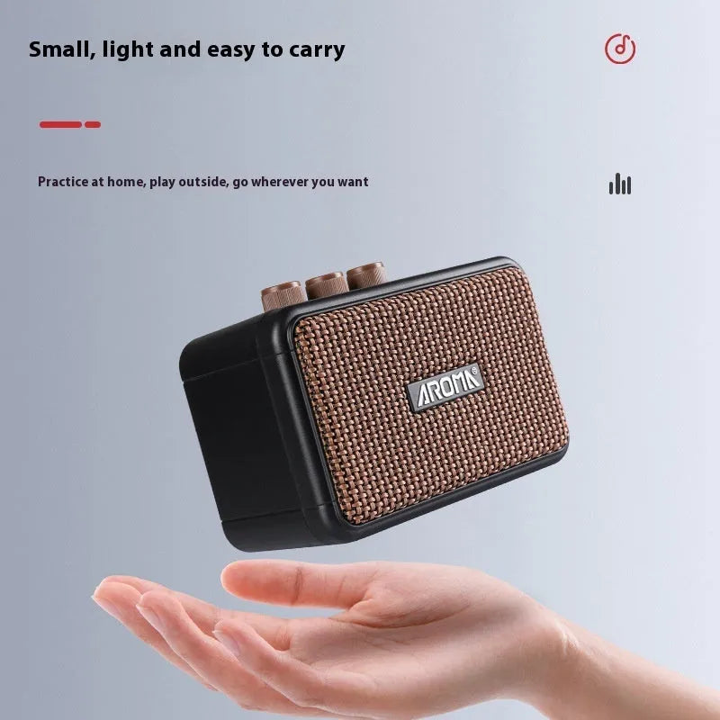 AG04 mini portable electric guitar loudspeaker box in plastic and electronic material for fitness and sports use