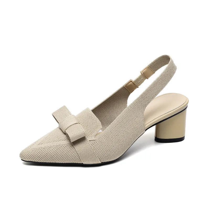 Women's black closed toe high heel sandals with a bow detail and an ankle strap on a rubber sole.
