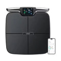 Black eight-electrode body fat smart scale showing digital display.