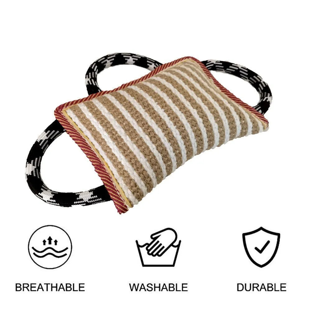 Dog tug of war toy with blue jute bite pillow and three rope handles on a wooden floor.