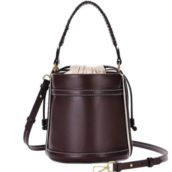 Brown PU leather bucket bag with woven texture, dual handles, and contrast stitching on a neutral background