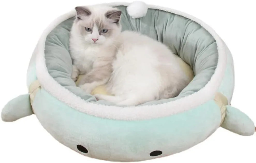 Green dinosaur-shaped cat bed shown both flat as a sofa and hung as a hammock for small pets.