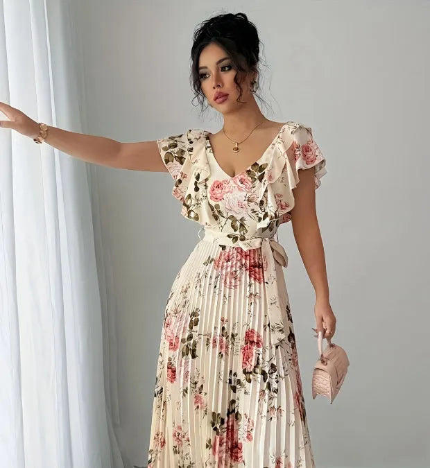 Apricot-coloured women's floral print dress with a V-neckline, ruffled short sleeves, and a flowing swing skirt.