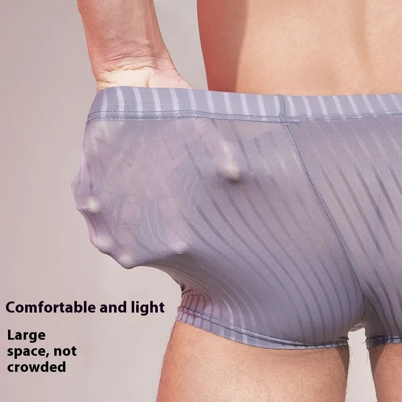 Men's striped underwear in thin transparent nylon fabric, shown in black, white, and dark grey colours.