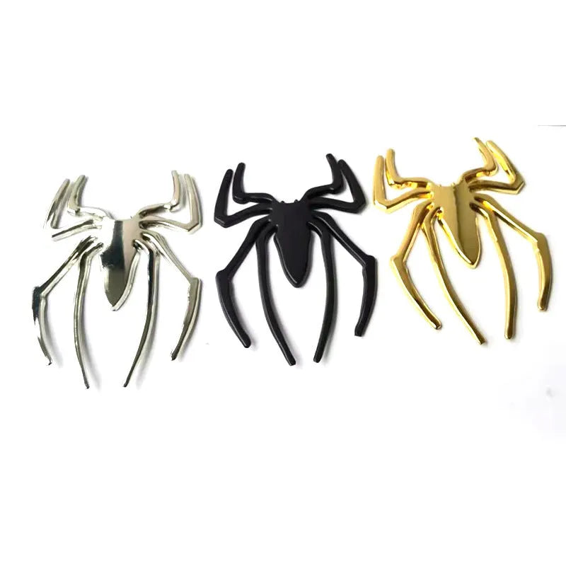 Three-dimensional metallic spider sticker in gold, silver, black, and red colours