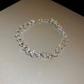Silver metal bracelet with heart shape and inlaid zircon stones for women