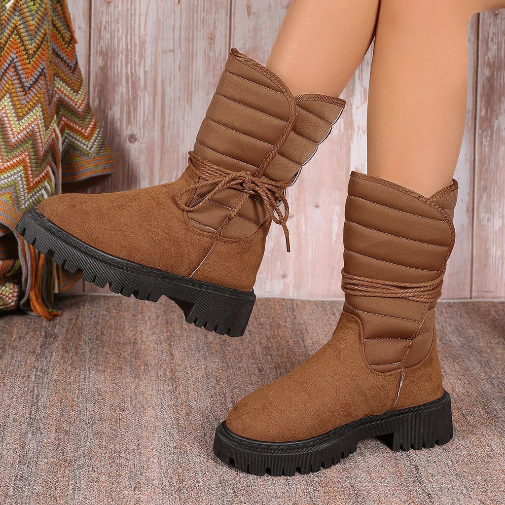 Women's black suede chunky heel snow boots with lace-up design and fleece lining.