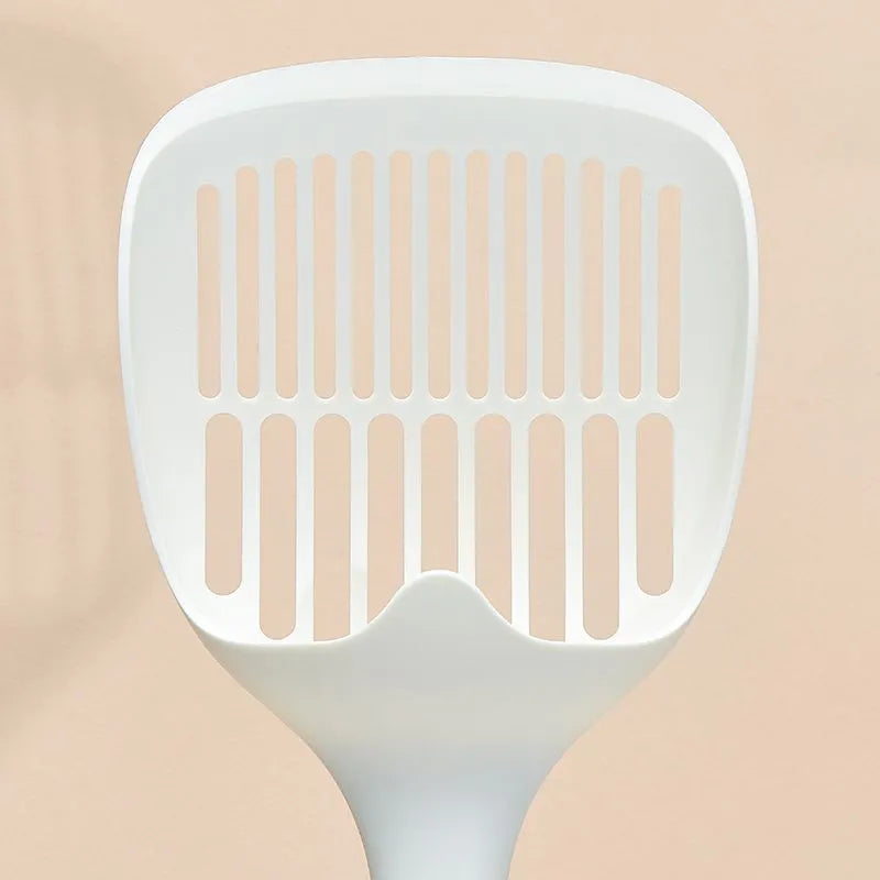 White plastic cat litter scoop with base on a clean surface, 29.5x12.8cm