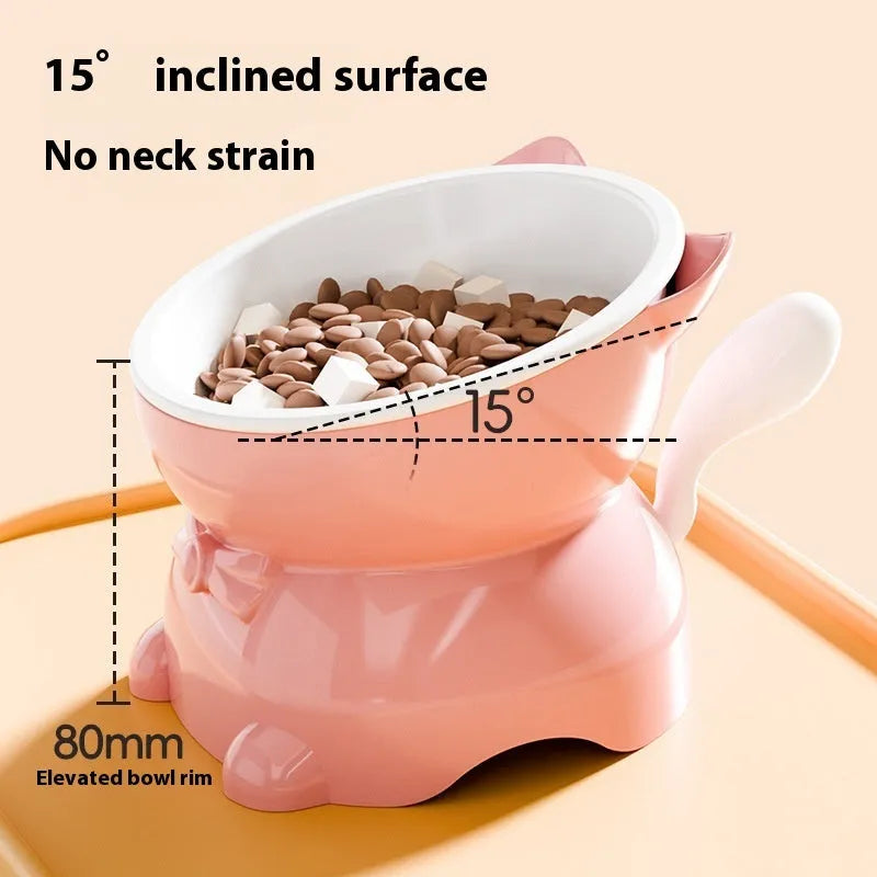 Slanted stainless steel cat bowl in blue with weighted silicone non-slip base on a wooden floor.