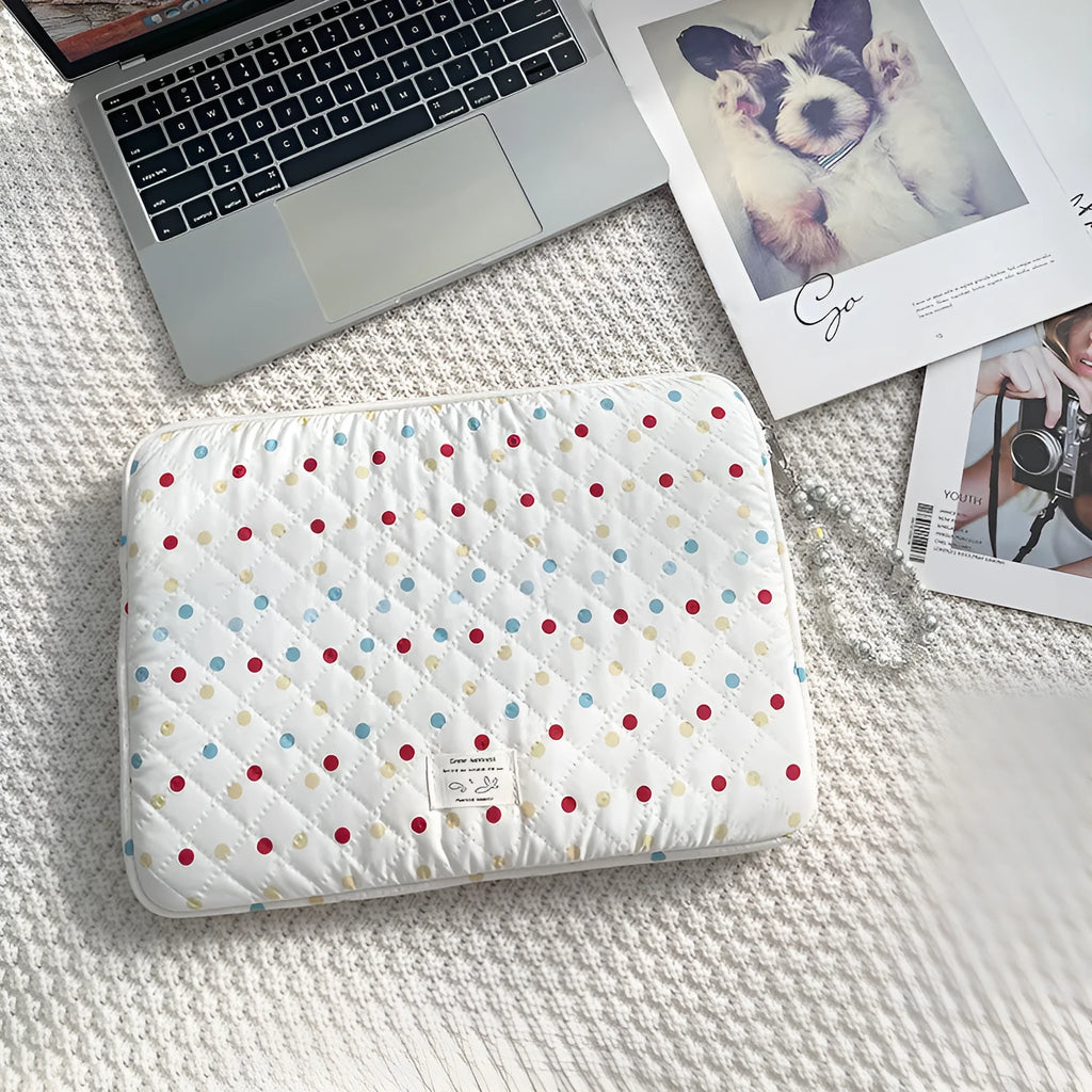 Polka dot patterned laptop bag for women, shown in available sizes for 11-inch to 15.6-inch laptops.