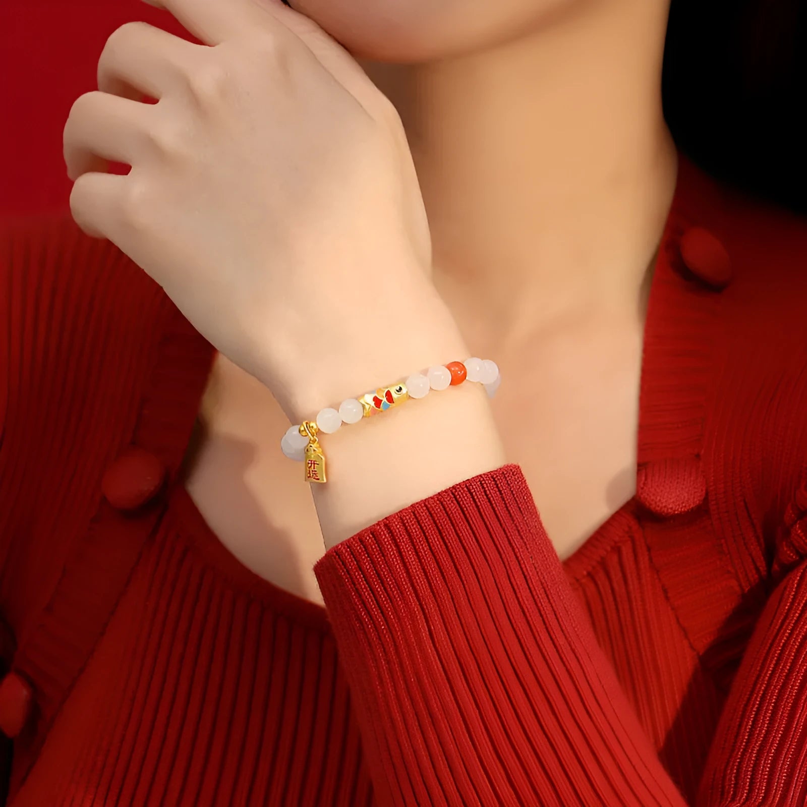 S925 sterling silver bracelet with a natural Hetian jade koi fish charm and cold enamel details.