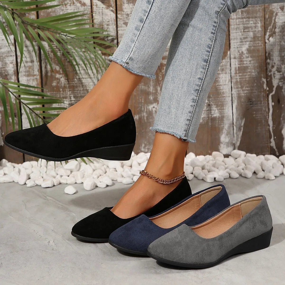 Women's pointed toe suede wedge pumps in light brown with a low rubber sole.