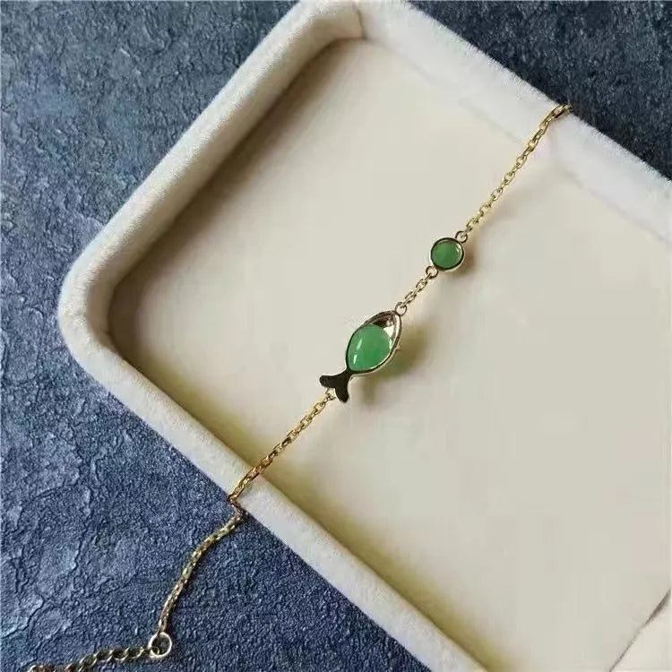 Copper retro-style bracelet with a yellow gold electroplated finish on a wrist.