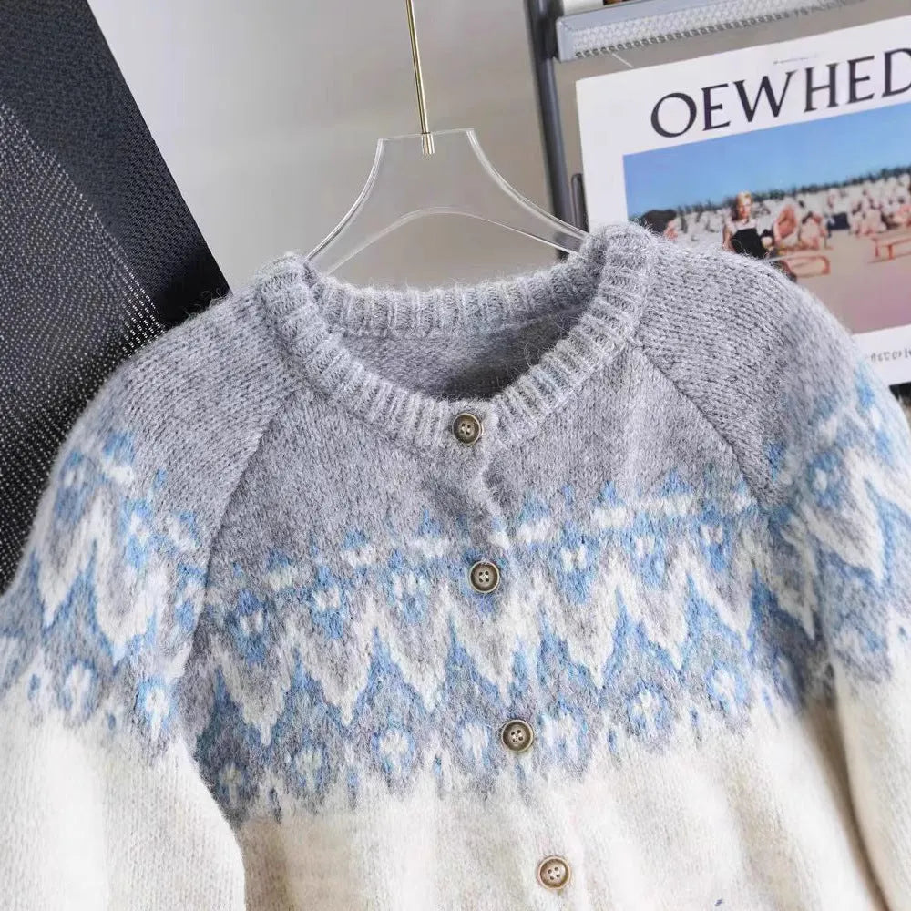 Women's beige jacquard patterned thick knit sweater coat with a loose fit and long sleeves.