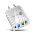 Black and white dual USB travel charger with international plug options showing indicator light