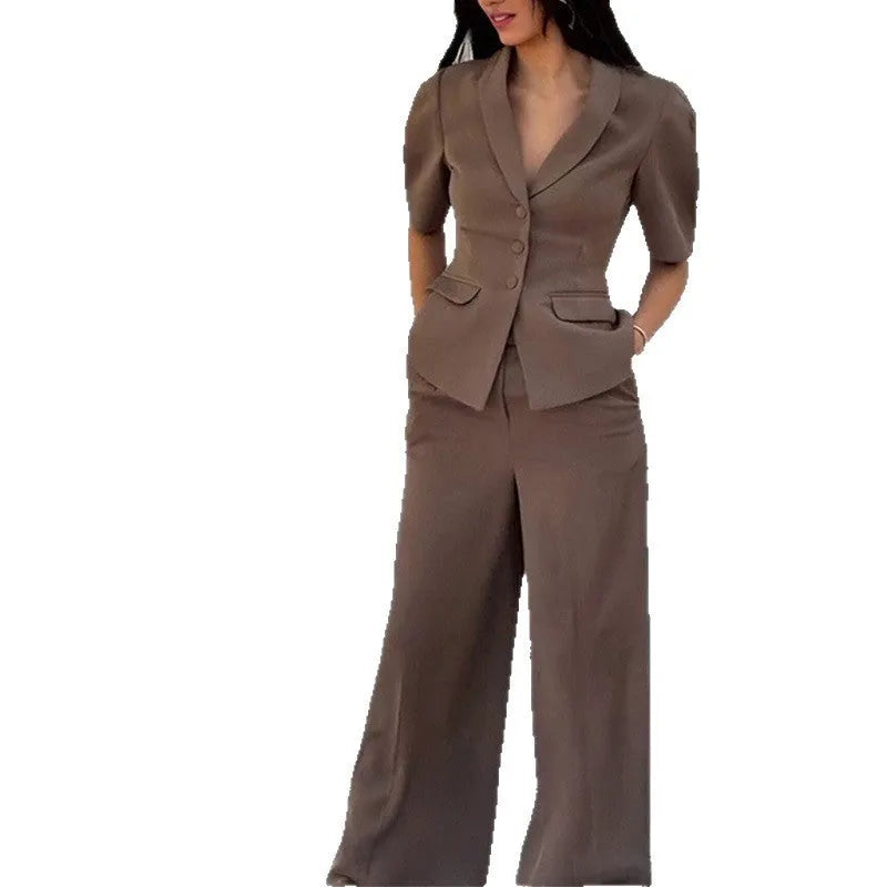 Brown men's slim fit polyester suit with long sleeve top and trousers laid flat.