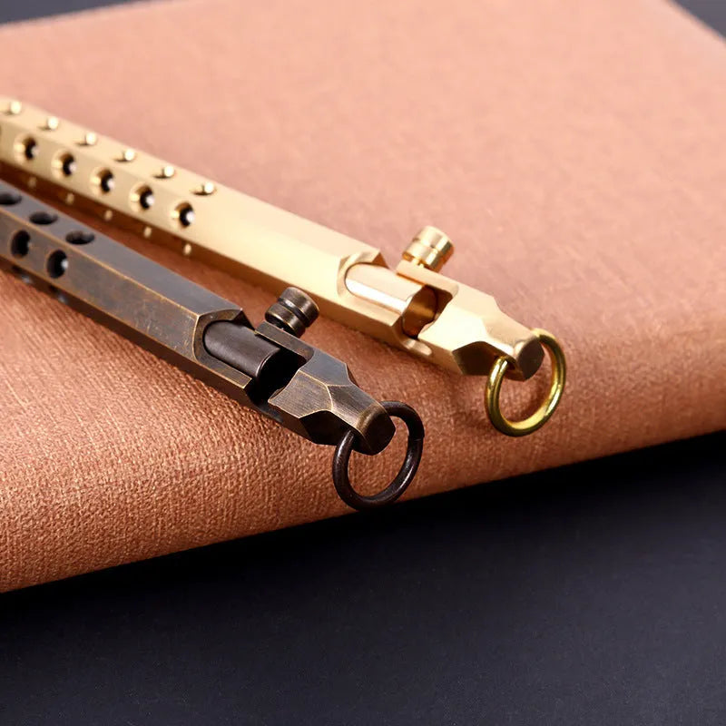 Brass hexagonal bolt-action pen showing six-angle design and bolt mechanism