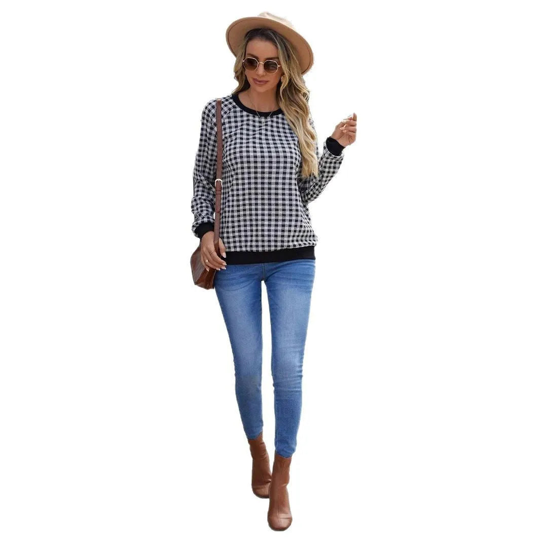 Black plaid stripe long sleeve pullover sweater laid flat, showing Japanese style pattern.