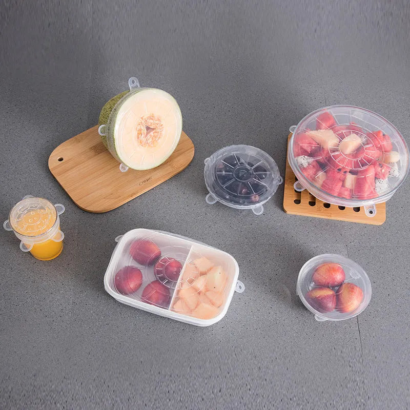 Set of six colourful silicone stretch lids in different sizes for covering bowls and food containers.