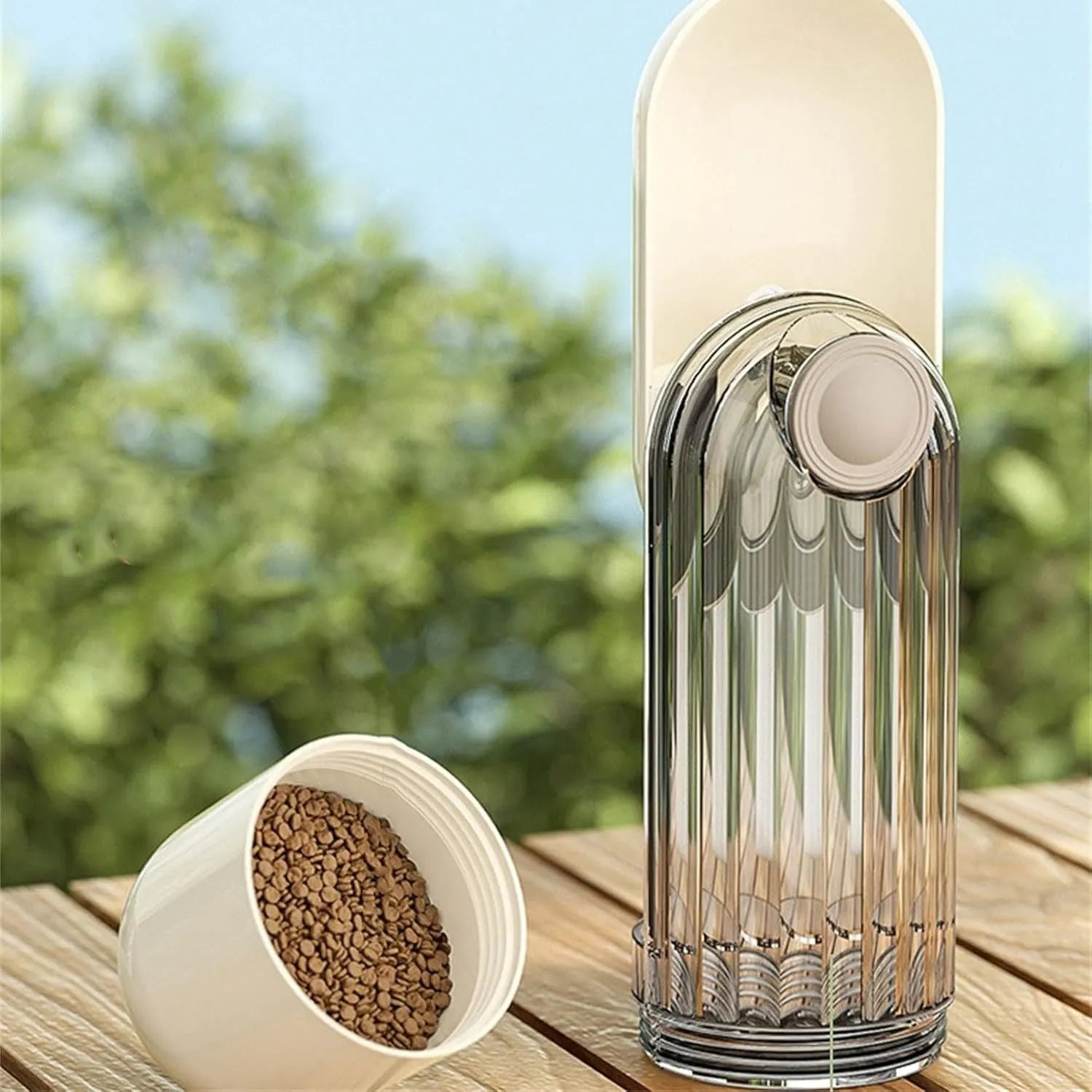 Foldable portable dog water bottle with built-in food dispenser in beige or green.