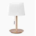 Walnut coloured solid wood bedside lamp with a white fabric lampshade and a cable switch