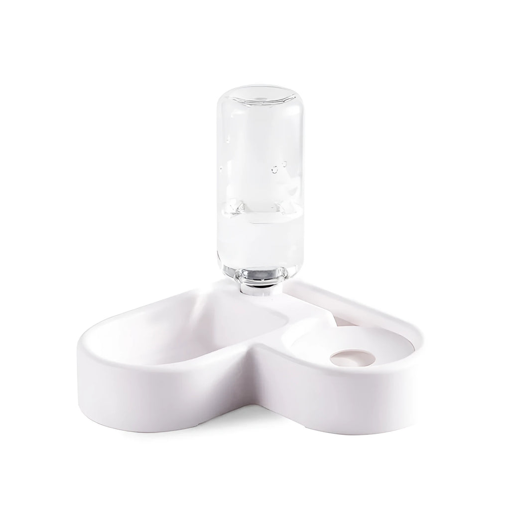 White plastic pet water fountain with electric pump on a floor.