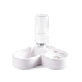 White plastic pet water fountain with electric pump on a floor.