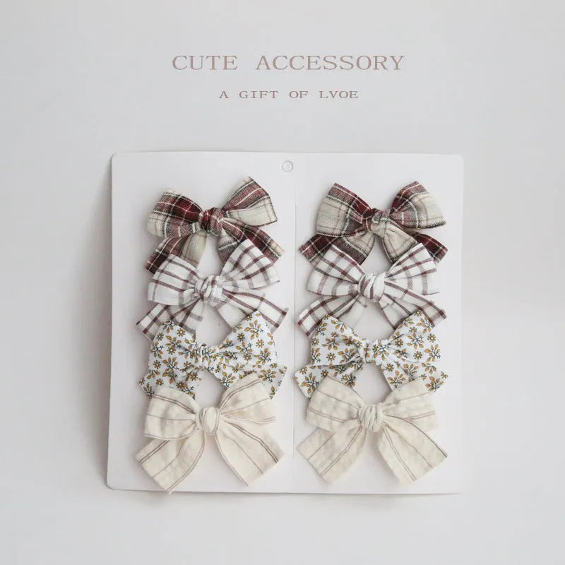 Dovetail bow hairclip set for children in cloth material with eight colour options