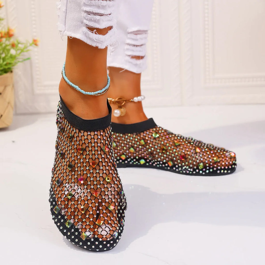 Women's colourful rhinestone flat sandals with mesh upper and rubber sole.