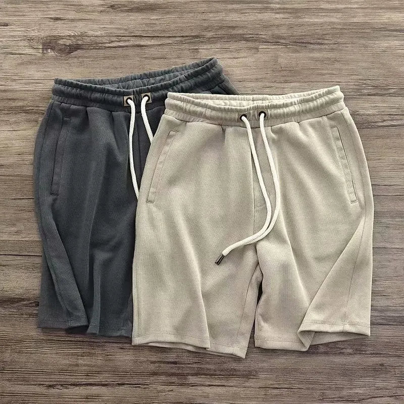 Men's retro loose knitted shorts in polyester, long leg, mid-waist, available in khaki, grey, and black, sizes M to XXXL