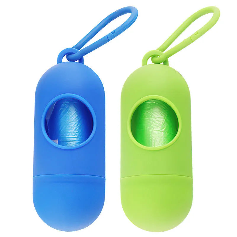 Black dog waste bag holder with Velcro strap and metal hook, showing bag dispenser slot.