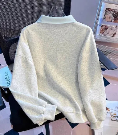 Women's fake two-piece sleeveless sweater top with tie polo collar and plush fabric, blue or gray, cropped length.