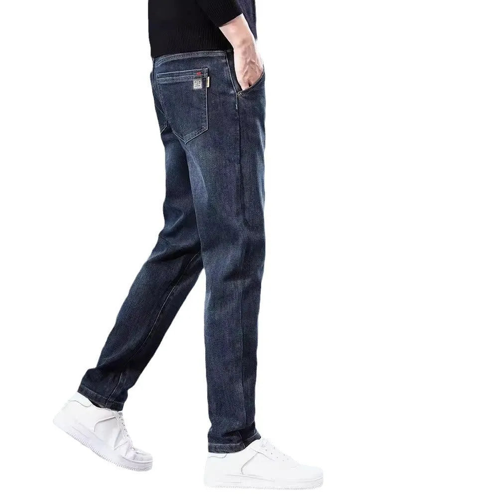 Men's slim straight casual trousers in blue grey colour showing loose fit and pencil-leg style.