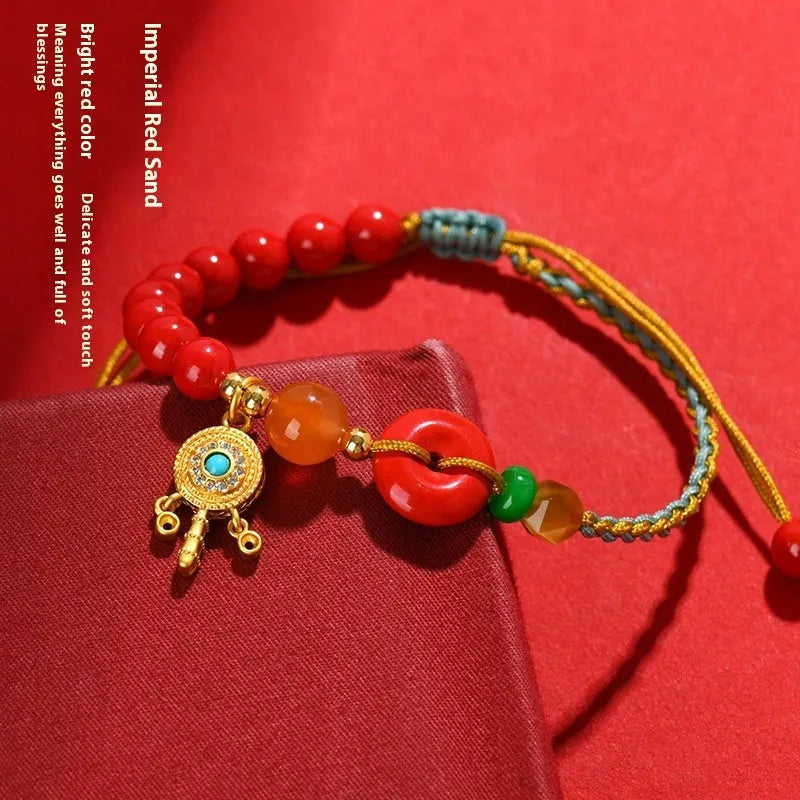 Red cinnabar bracelet with geometric patterns and peace buckle closure