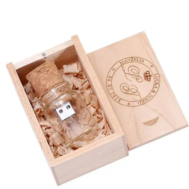 Transparent bottle-shaped USB flash drive with a wooden charm inside, showing metal connector.