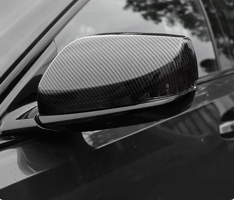ABS plastic rearview mirror cover for Cadillac CT5 and CT6 models in carbon fibre, silver, or rain frame pattern.