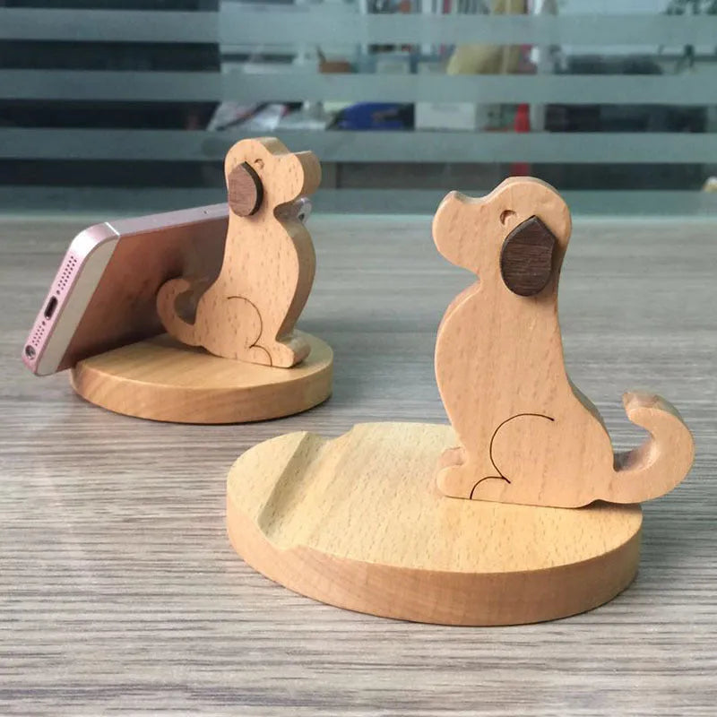 Brown solid wood desktop phone holder shaped like a cartoon puppy with spray paint finish