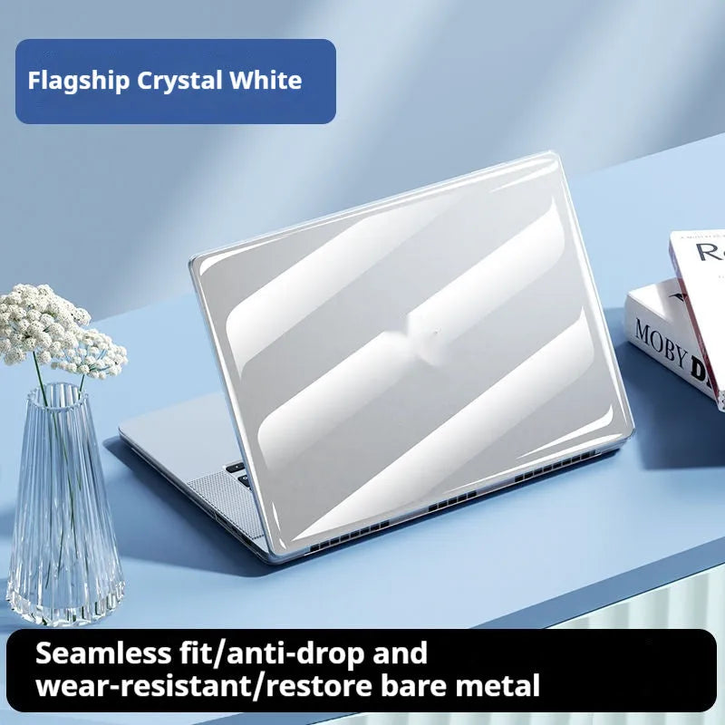 Clear hard plastic protective case for a MacBook laptop on a table.